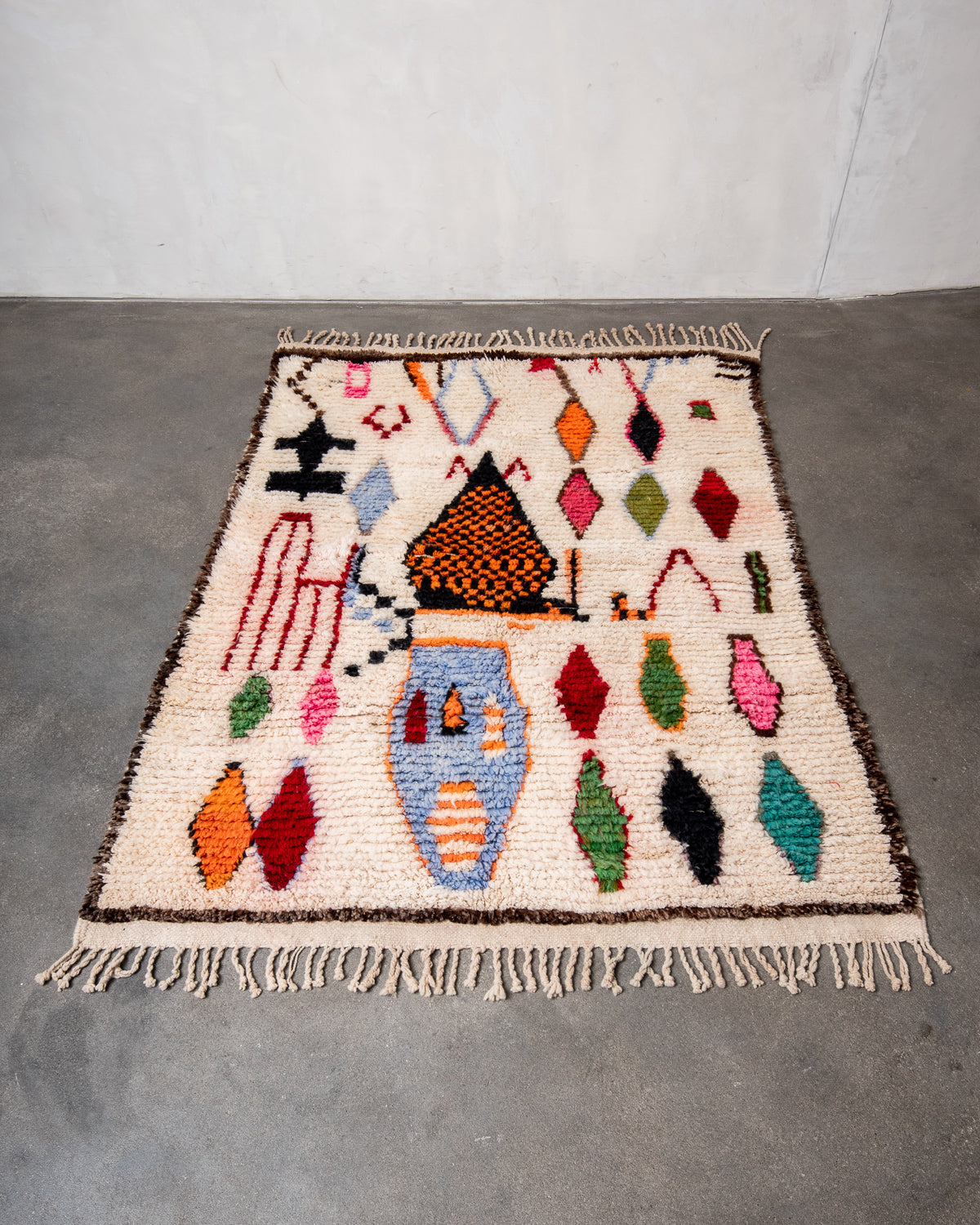Modern, designer, handcrafted Berber rug from Morocco. Beniourain carpet with beautiful colours and patterns and fluffy wool texture.